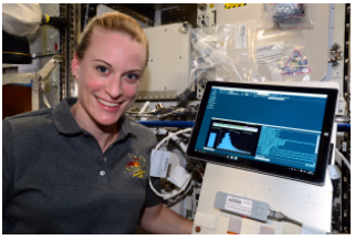 NASA astronaut Kate Rubins aboard the International Space Station with the MinION sequencer